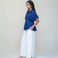 PLEATED PEPLUM SHIRT